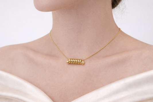 Zarinis Minimal Gold Plated Necklace Featuring A Sleek Spiral Ring Pendant Showcasing Contemporary Styling