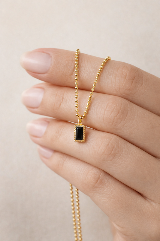 Zarinis Chunky Gold Chain With Black Crystal Pendant Front View Showing Faceted Black Crystal