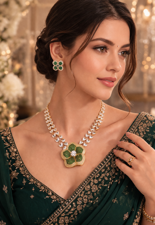 Woman wearing a green floral necklace and earrings with a blurred decorative background