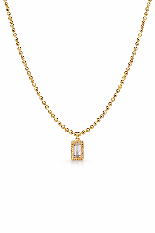 Zarini’s Chunky Gold Chain with White Crystal Pendant