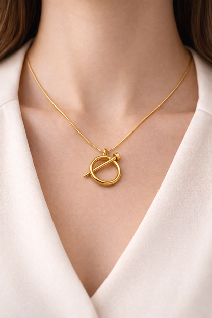 Zarini’s Stylish Gold-Plated Nail-Inspired Pendant Necklace