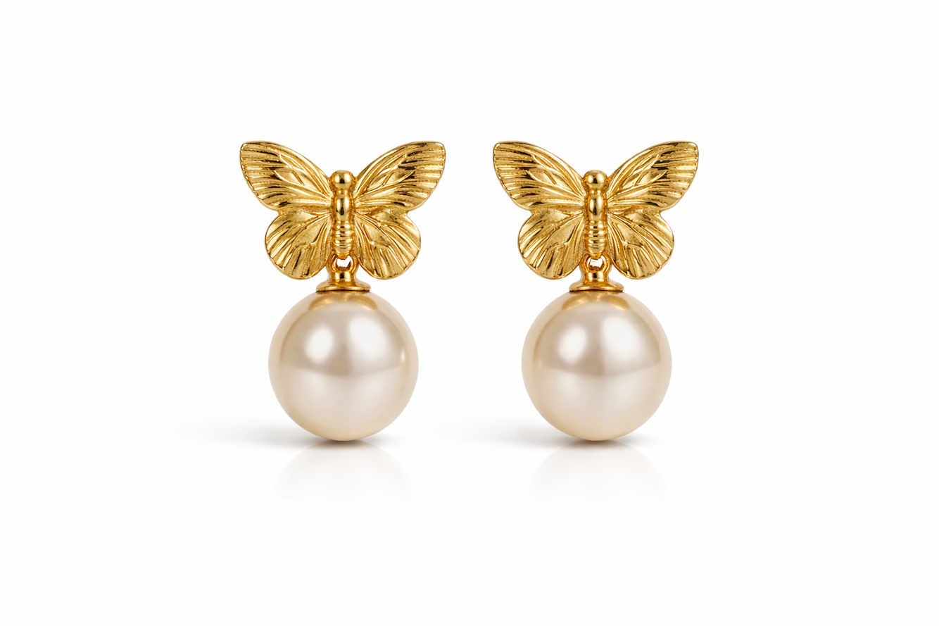 Zarini’s pair of gold-toned butterfly pearl drop earrings