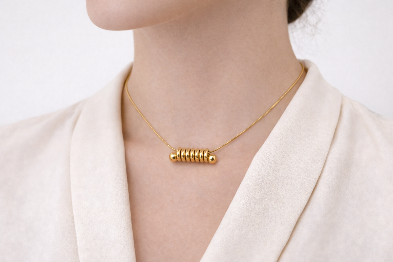 Zarini’s Minimal Gold Plated Necklace Featuring a Sleek Spiral Ring Pendant