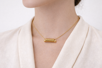 Zarini’s Minimal Gold Plated Necklace Featuring a Sleek Spiral Ring Pendant