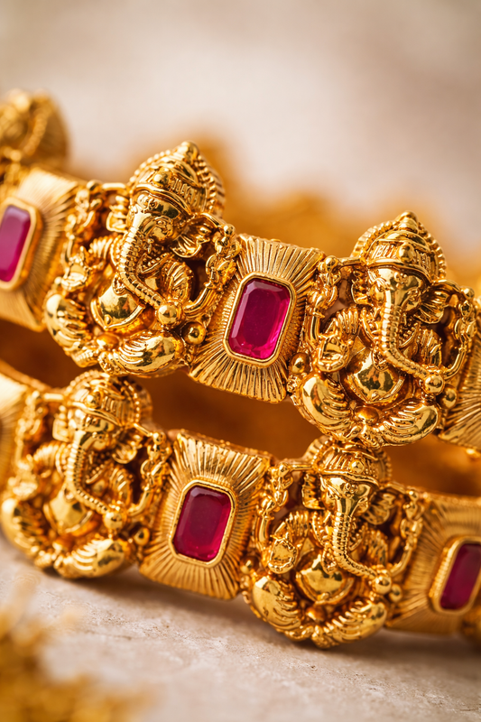 Zarini Gold-Toned Lord Ganesha Temple Kada Bangles with Ruby-Coloured Stones – Set of 2