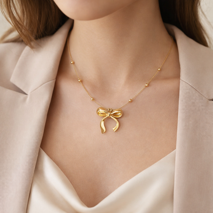 Zarini’s Gold Bow Pendant